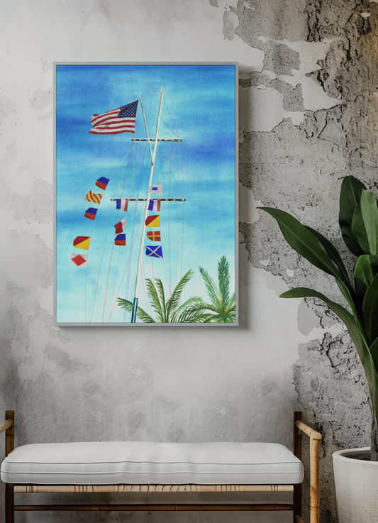 Eye of the Storm nautical flag wall art with tropical sky and sailboat flagpole, displayed in coastal home setting