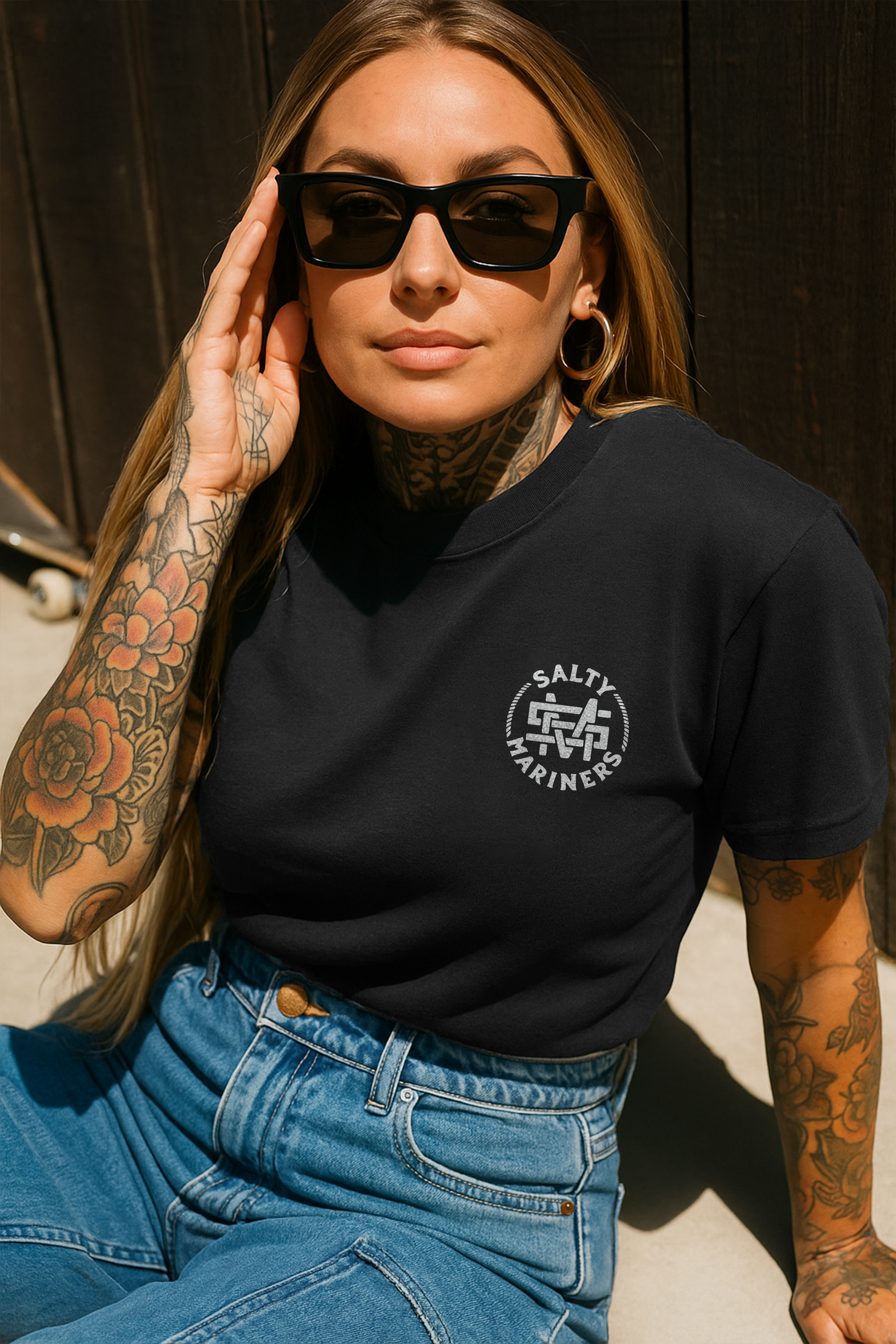 Funny lake life shirt from Salty Mariners – model showing off wakeboarding apparel near water